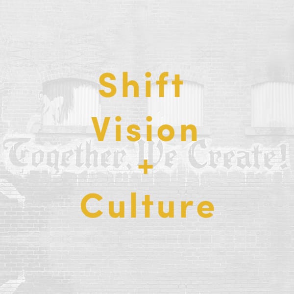 brick wall background with yellow text on top that says Shift Vision And Culture